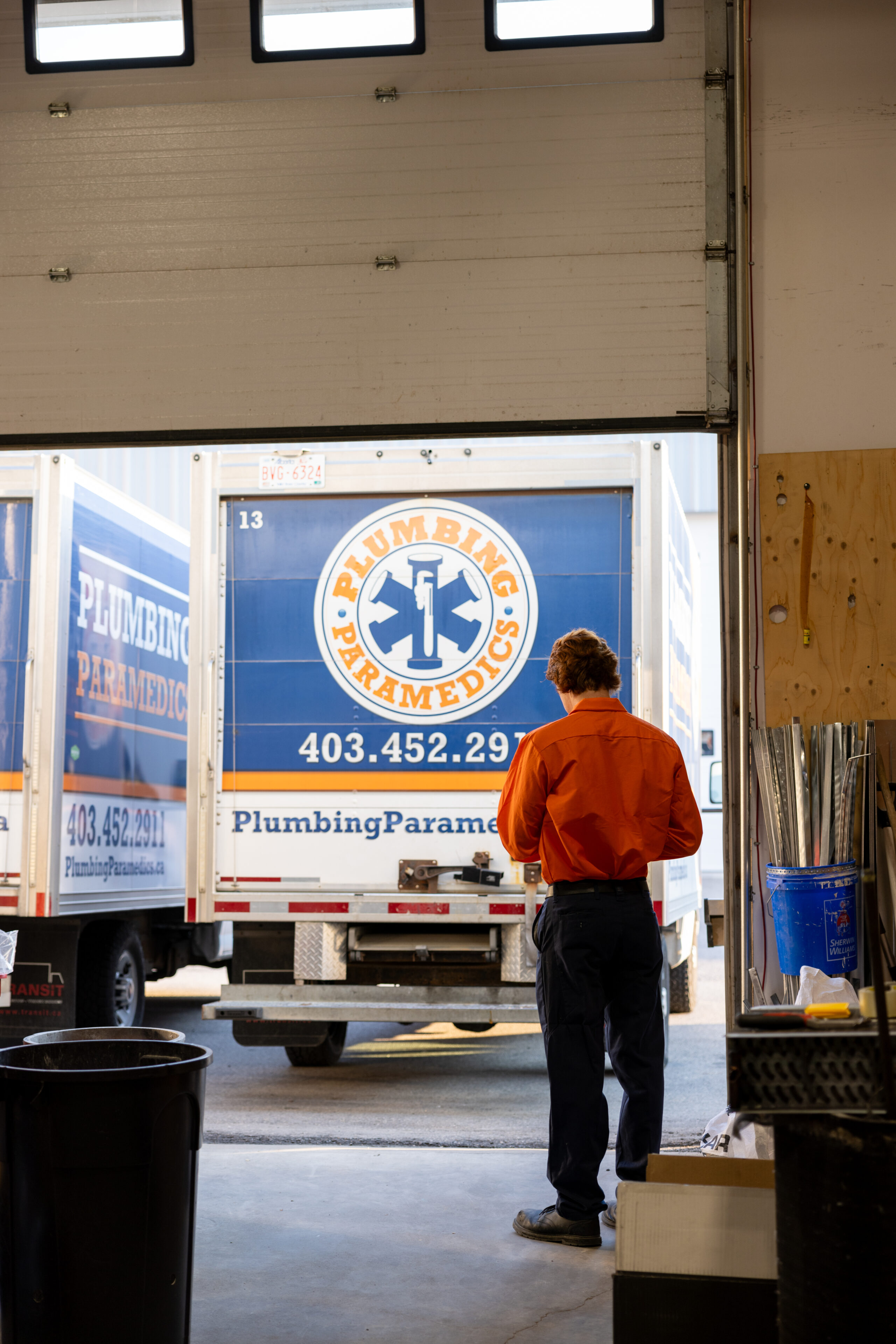 A technician is ready to tarvel in truck to repair air conditioner in Calgary, AB