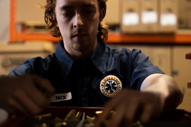 A technician performing HVAC Service In Chestermere, AB