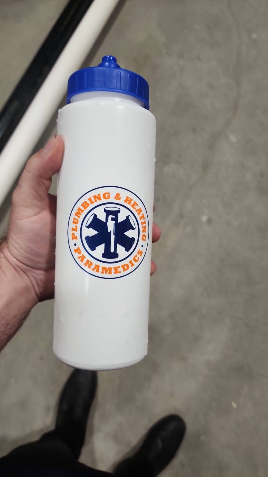 A white water bottle with a blue cap having company logo.