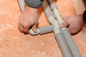 A professional technician repiping